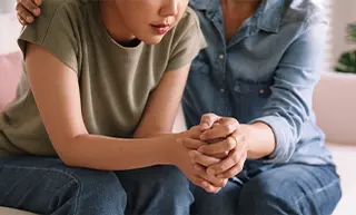 Mother Comforting Daugther